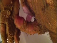 A horny man coated in filth jerks off his erect dick.